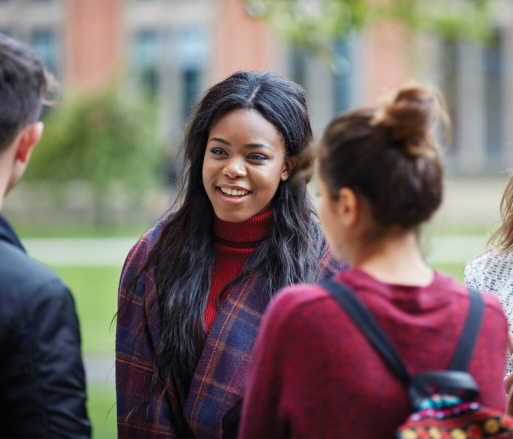 students chatting outside the University of Birmingham
