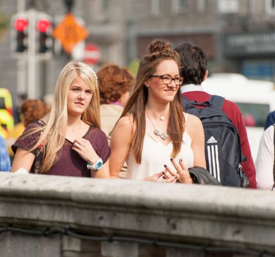 Two female students exploring Dublin on a bridge.