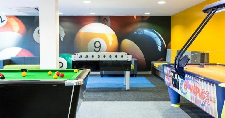 Games room with pool table and air hockey table