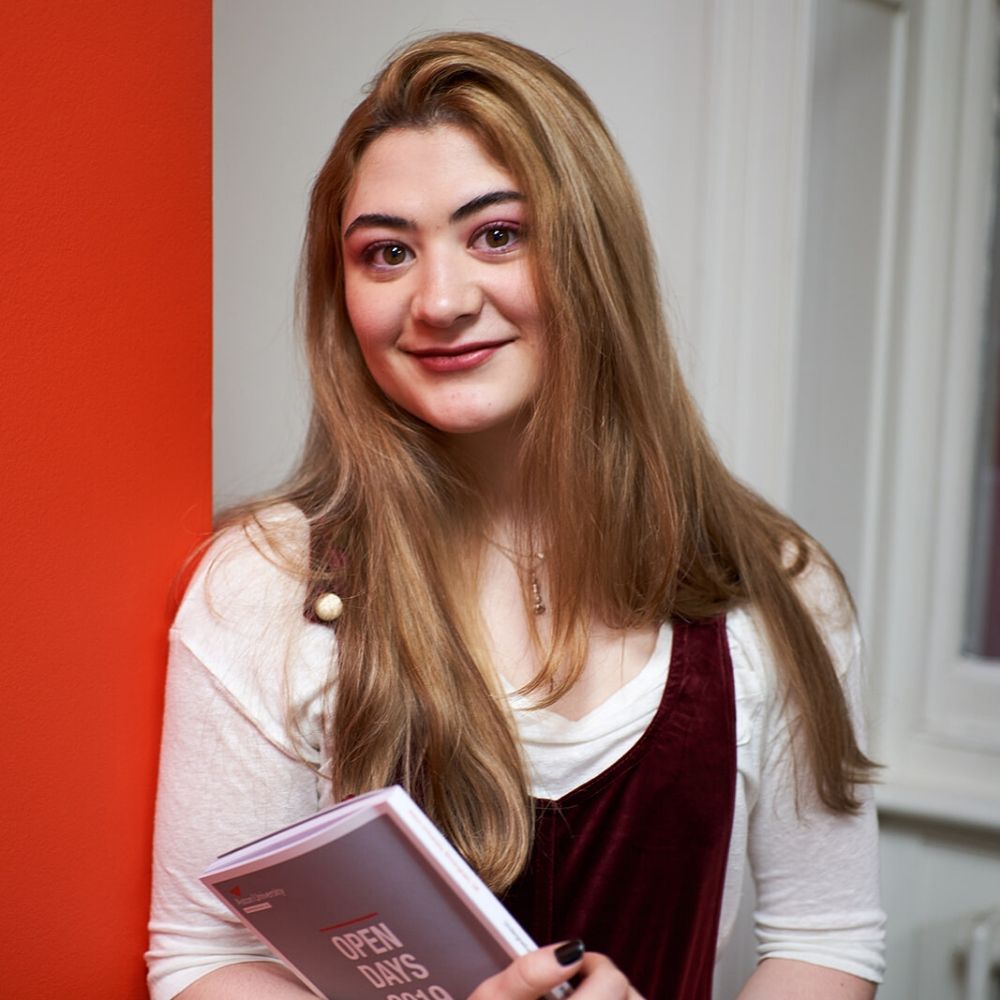 academic English student holding books at BSC London