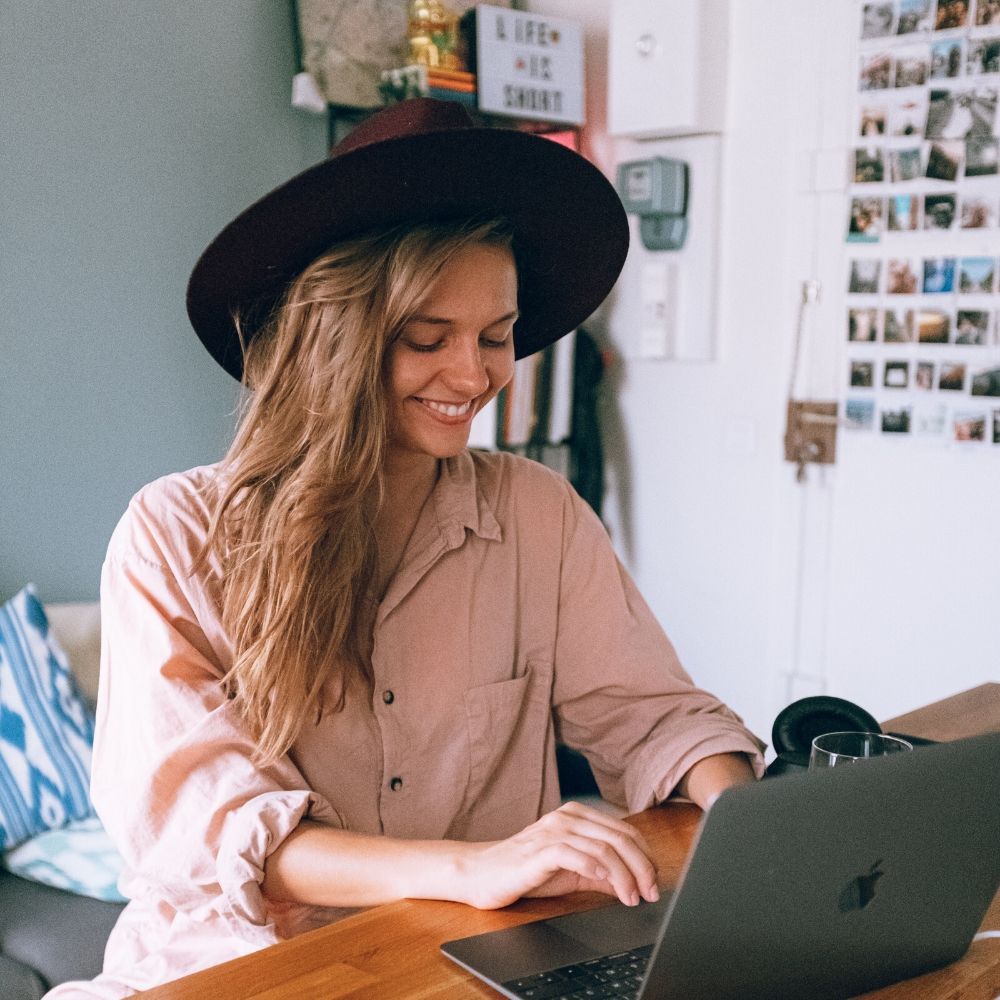 Girl in hat gaining valuable remote work experience with a virtual internship